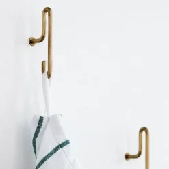 2 Ganchos de pared Moebe small, oro mate